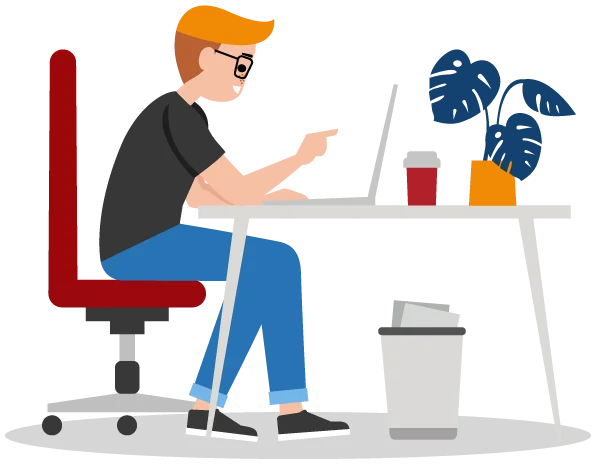 A person is sitting at a desk with a laptop in front of them. There is a plant on the desk and a garbage can on the floor