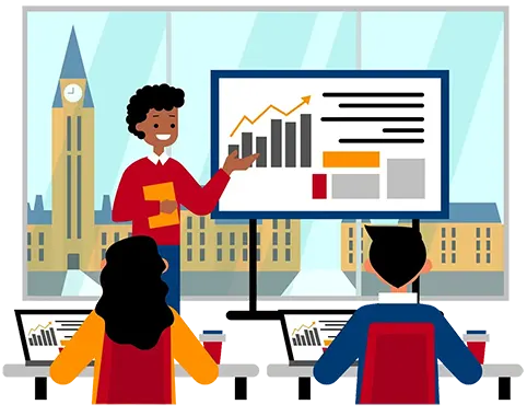 An instructor teaching a software class with the Parliament buildings outside